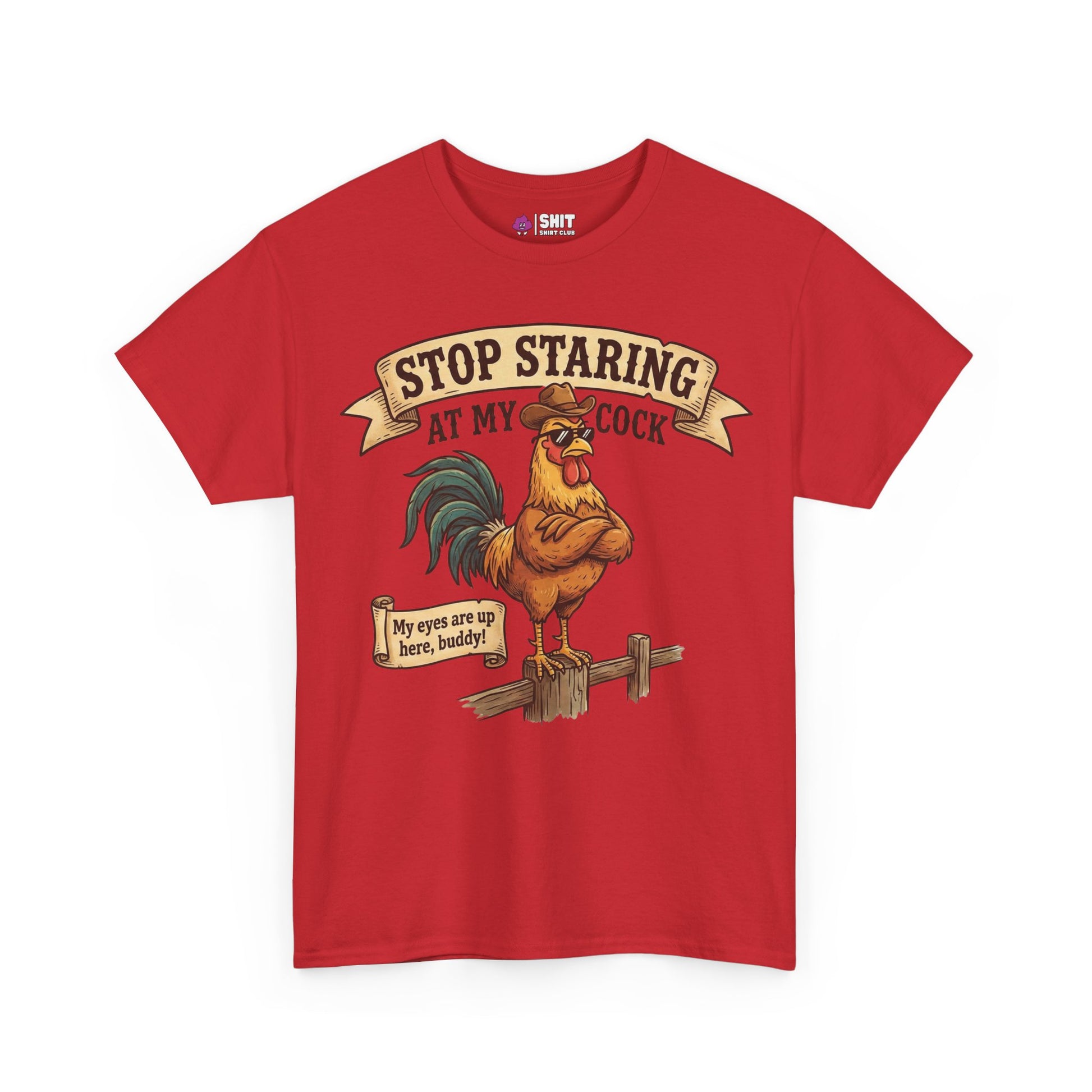 The Stop Staring at My Cock Tee features a red shirt with a cartoon rooster on a fence and the phrase above. Perfect for grooms or stag parties, it brings humor to any event. A sign by the rooster says, "My eyes are up here, buddy!.
