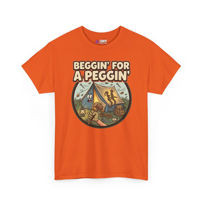 The Beggin' for a Peggin' Camping Tee is an orange funny t-shirt with cartoon designs of a tent, mountains, animals, food, and two silhouetted people—ideal as a cheeky gift or quirky festival outfit.