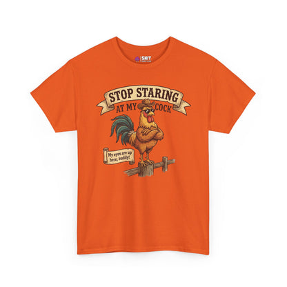 The Stop Staring at My Cock Stag Do Tee is an orange t-shirt with a cartoon rooster on a fence, text above, and a speech bubble saying “My eyes are up here, buddy!”—ideal for stag parties or as a funny groom shirt.