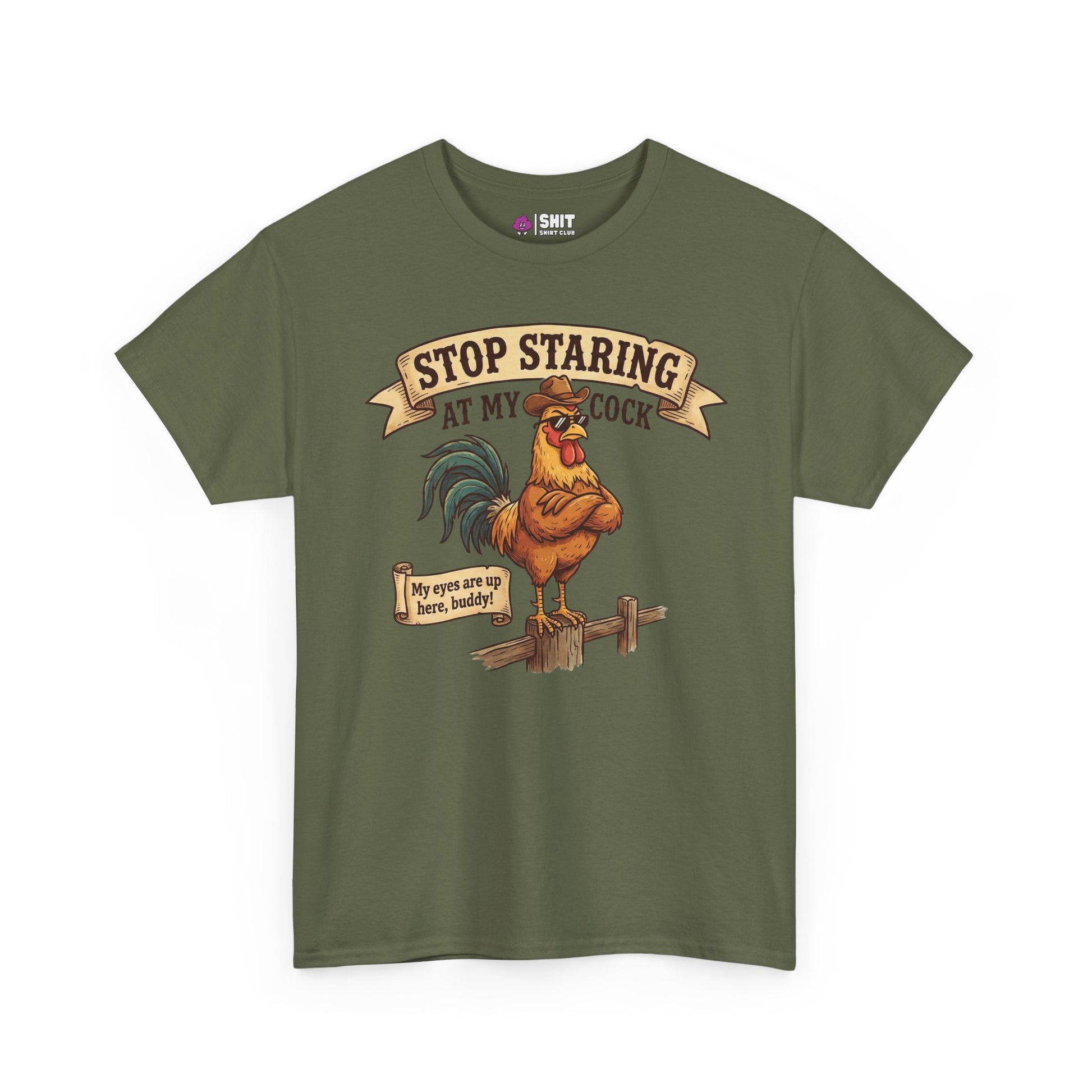 The Stop Staring at My Cock Stag Do Tee features an olive green color, an illustrated rooster on a fence, and bold text: “STOP STARING AT MY COCK” above and “My eyes are up here, buddy!” below. Perfect funny groom shirt for stag parties.