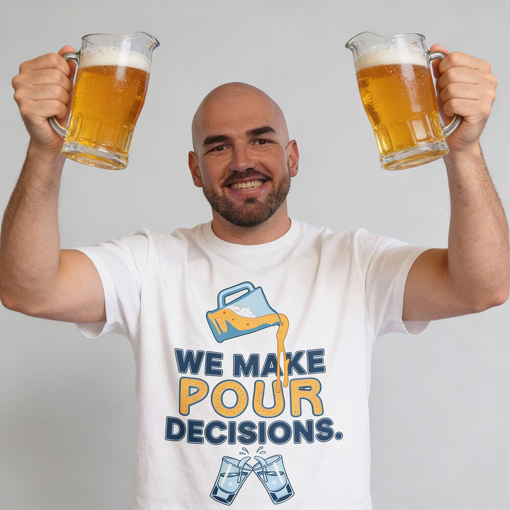 A smiling man holds two beer pitchers while wearing the “We Make Pour Decisions Stag Do Tee,” featuring the slogan, an image of beer being poured, and two clinking beer mugs beneath the text.