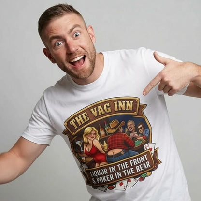 A smiling man points at his white The Vag Inn Stag Do Tee, a funny party shirt with a cartoon bar scene and the text: THE VAG INN - LIQUOR IN THE FRONT & POKER IN THE REAR.