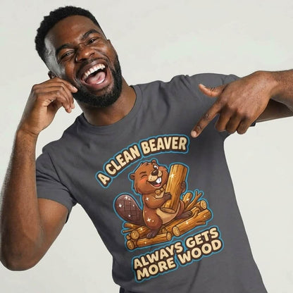 A man points to his "A Clean Beaver Always Gets More Wood" Stag Do Tee, featuring a cartoon beaver on logs with the playful slogan—perfect for matching stag do outfits!.