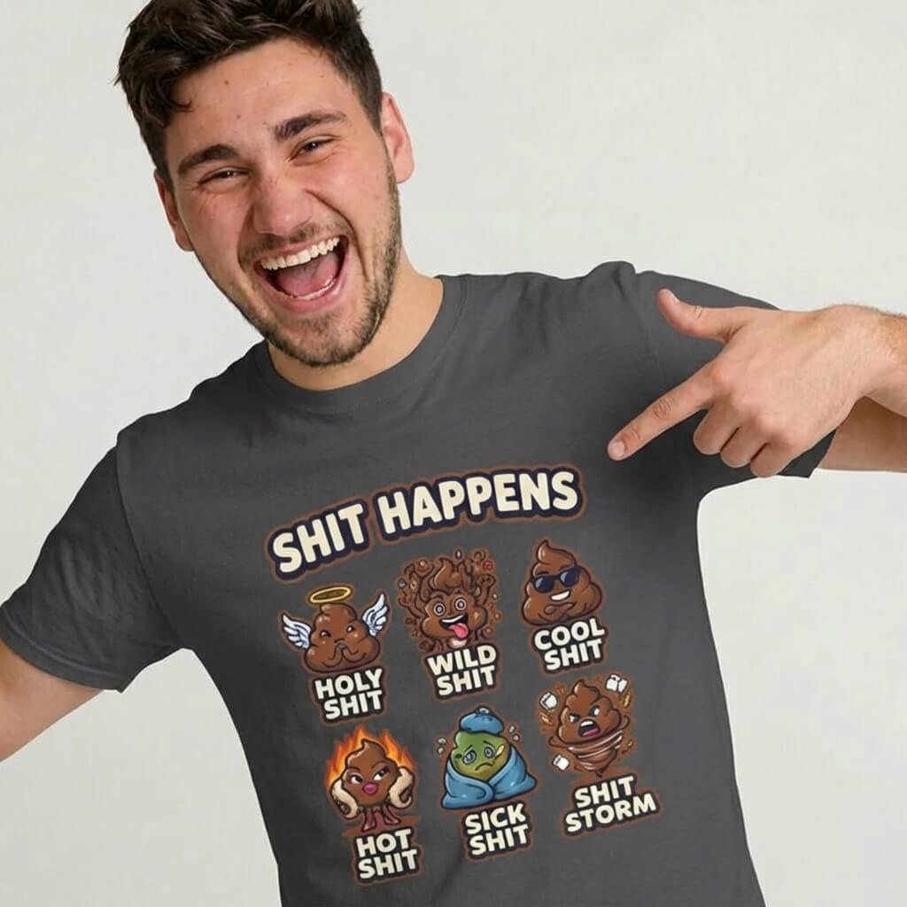 A smiling man points to his dark gray Shit Happens Stag Do Tee with cartoon poop characters and labels: holy, wild, cool, hot, sick, and storm—making it perfect for matching stag do outfits.