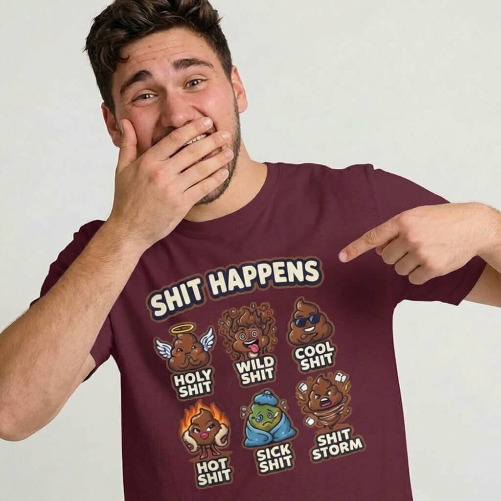 A smiling man covers his mouth and points to his maroon Shit Happens Stag Do Tee, which features cartoon poop emojis with labels—an ideal choice for funny, matching stag do outfits.