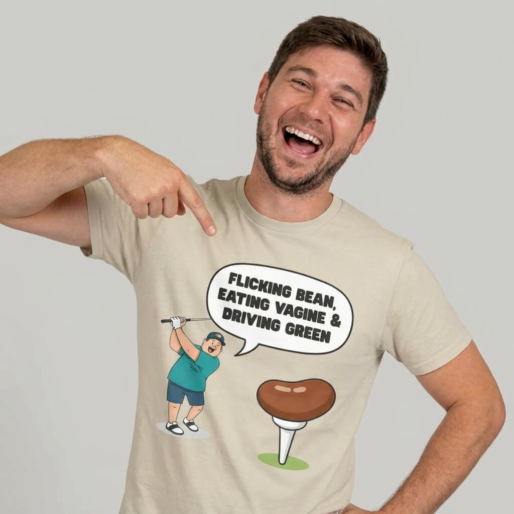 A smiling man points at his "Flicking Bean, Eating Vagine & Driving Green" Tee, a hilarious golf shirt with a cartoon golfer, tee, and cheeky slogan—perfect for golfers with a sense of humor.