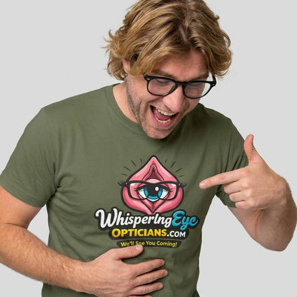 A blond man with glasses smiles and points at his green Whispering Eye Opticians Logo Tee ("We’ll See You Coming!")—a fun stag do t-shirt featuring a cartoon pink eye.