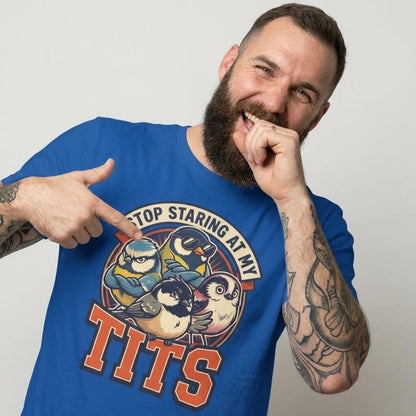 A bearded man points to his “Stop Staring at My Tits” Stag Do Tee, featuring cartoon tit birds and bold text. This funny groom gift or stag do outfit is sure to stand out.