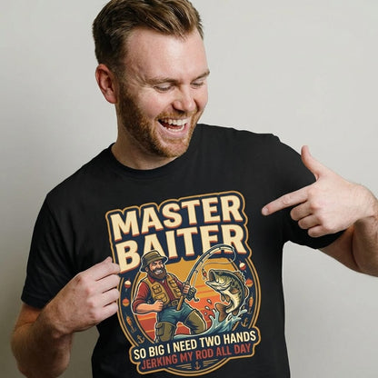 A smiling man points at his Master Baiter Rude Fishing Tee, featuring a cartoon fisherman and the cheeky text: So Big I Need Two Hands—perfect as a funny fishing gift or humorous fishing t-shirt.