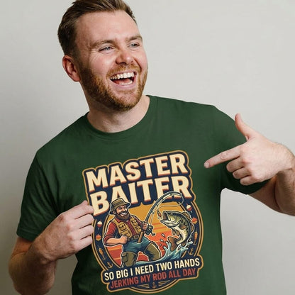A bearded man points at his Master Baiter Rude Fishing Tee, a humorous shirt with a cartoon fisherman and the phrase, "MASTER BAITER. So big I need two hands. Jerking my rod all day.