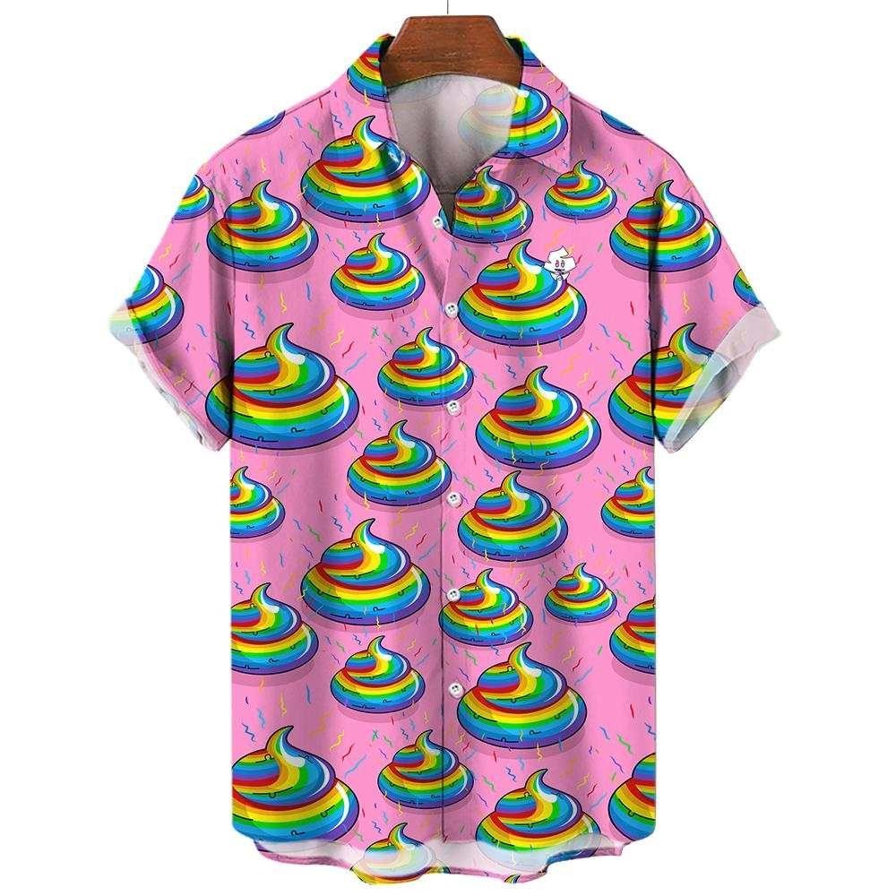 The Unicorn Poo Shirt is a short-sleeved, button-up shirt with a pink background, featuring rainbow poop emojis and sprinkles in a fun all-over print. Displayed on a wooden hanger.