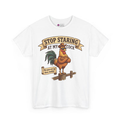 The Stop Staring at My Cock Tee showcases a funny rooster with sunglasses on a fence, sporting witty text. Ideal for stag parties, this shirt brings laughs with its quirky design and humorous message.