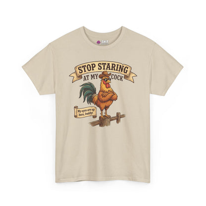 Stop Staring at My Cock Stag Do Tee—beige shirt with a cartoon rooster and cheeky text, perfect as a funny groom or stag party tee. Vintage-style illustration adds bold, playful humor for a standout look.