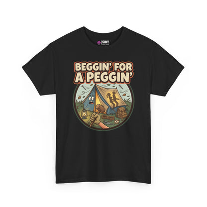 The Beggin' for a Peggin' Camping Tee features a cartoon raccoon with camping gear and bold text, making it a hilarious gift or funny festival shirt for friends who love unique, cheeky styles.