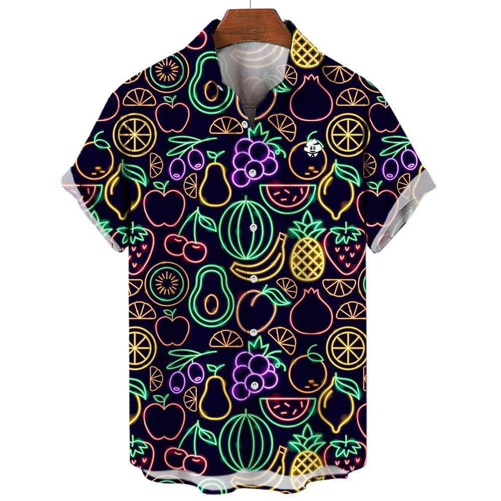 The Fluorescent Fruit Fiesta Shirt is a short-sleeve button-up featuring neon pineapples, watermelons, grapes, lemons, apples, and avocados on a dark background—a vibrant choice for any party. Displayed on a hanger.