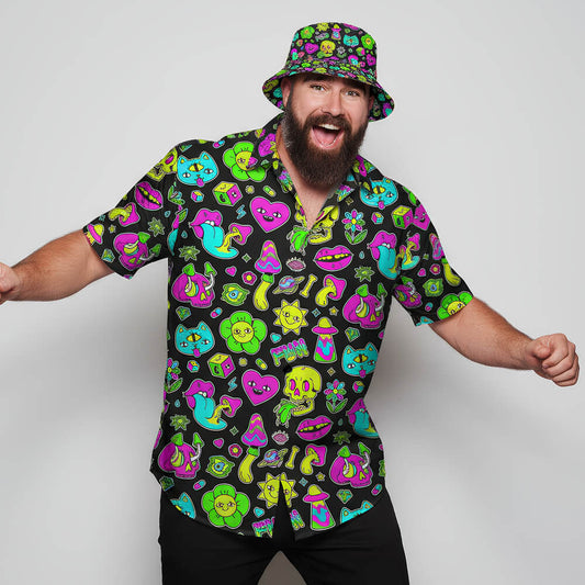 A bearded man poses energetically with arms outstretched, smiling in a Black Out Mushroom Shirt and matching bucket hat—a bold statement for festival fashion—against a plain light gray background.
