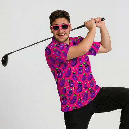A man wearing the Jolly Todger Eggplant Golf Polo Shirt and pink sunglasses poses enthusiastically with a golf club against a plain background—this vibrant, cartoon-eggplant polo is a true conversation starter.