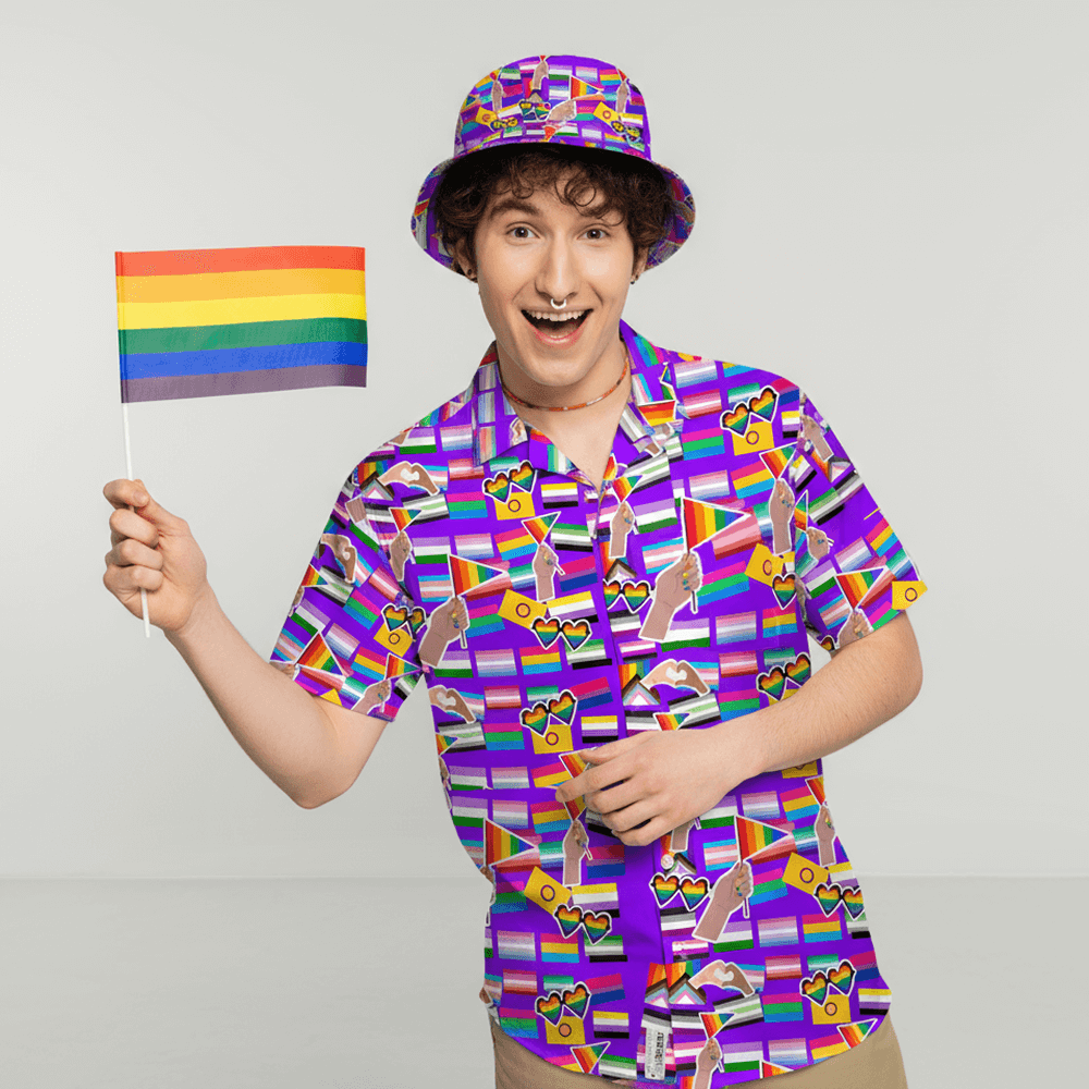 Person wearing the LGBTQ Pride Shirt and matching LGBTQ Pride Bucket Hat, holding a pride flag on a plain background