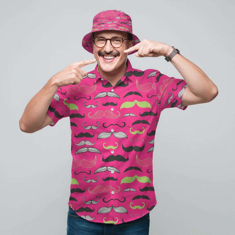 Man wearing the Movember Shirt and matching Movember Bucket Hat, pointing at his moustache 