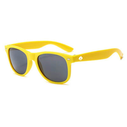 Retro Rays yellow-framed sunglasses with dark lenses are shown angled on a white background. A small white logo appears on the left arm, highlighting their classic style and built-in UV protection.