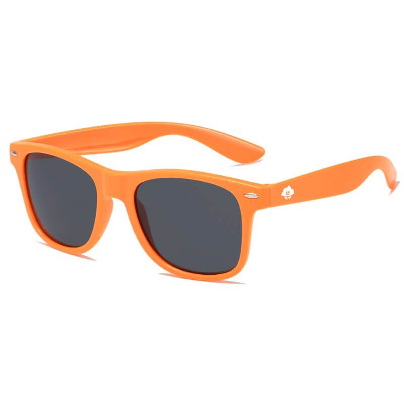 Retro Rays: Orange-framed Wayfarer sunglasses with black lenses, shown angled on a white background. A small white spade logo appears near the hinge on the left temple arm. Stylish and retro, they provide reliable UV protection.