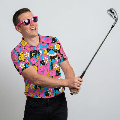 A smiling man in a Trippy Space Golf Polo Shirt and pink novelty sunglasses holds a golf club as if about to swing, standing against a plain light gray background.