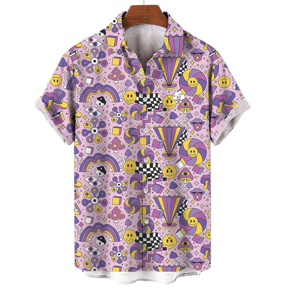 The Hippie Shirt is a short-sleeve top with a vibrant, abstract pattern of smiley faces, rainbows, checkerboards, swirls, stars, and geometric shapes in purple, yellow, pink, and black on a light background.